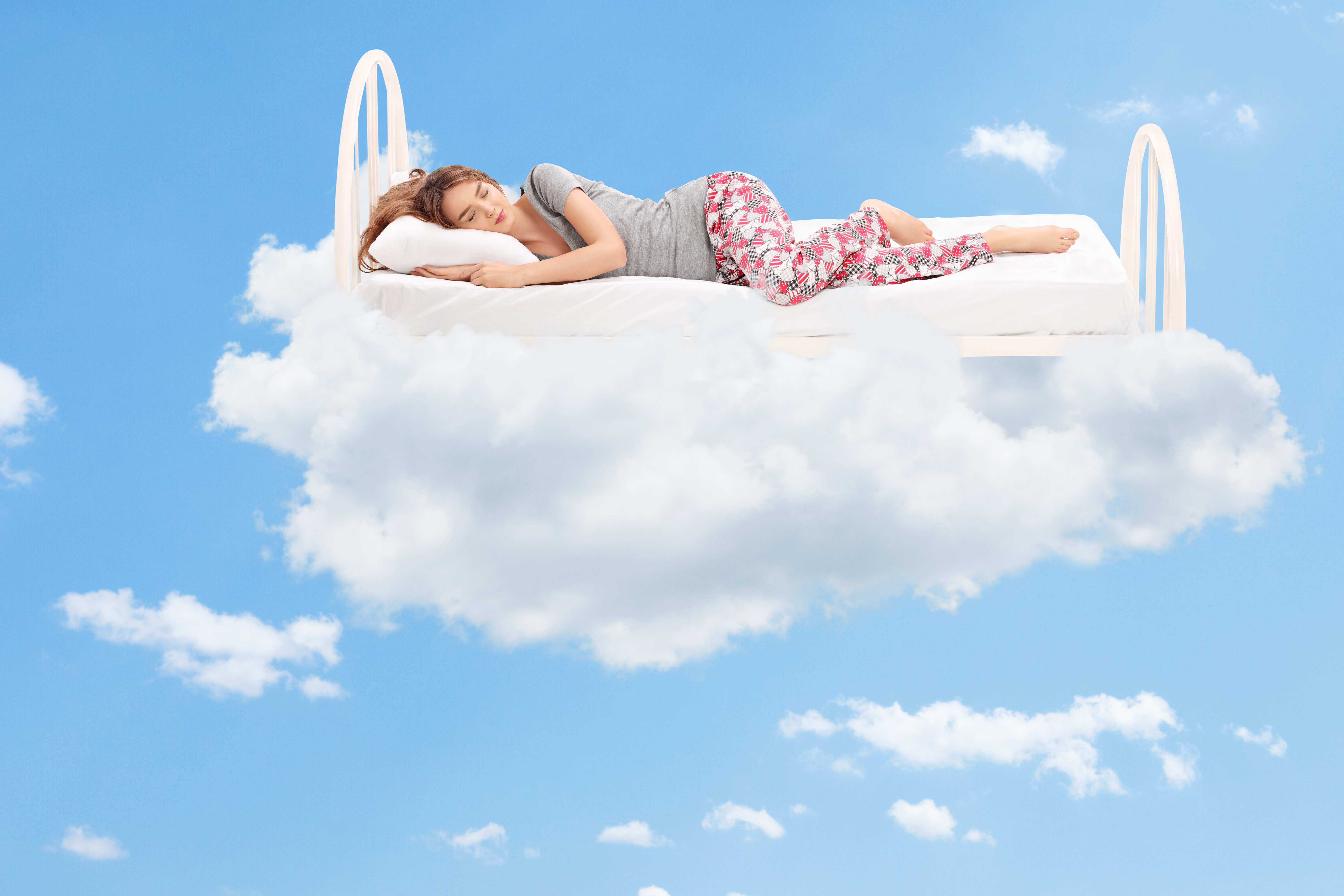 lady sleeping on bed in cloud