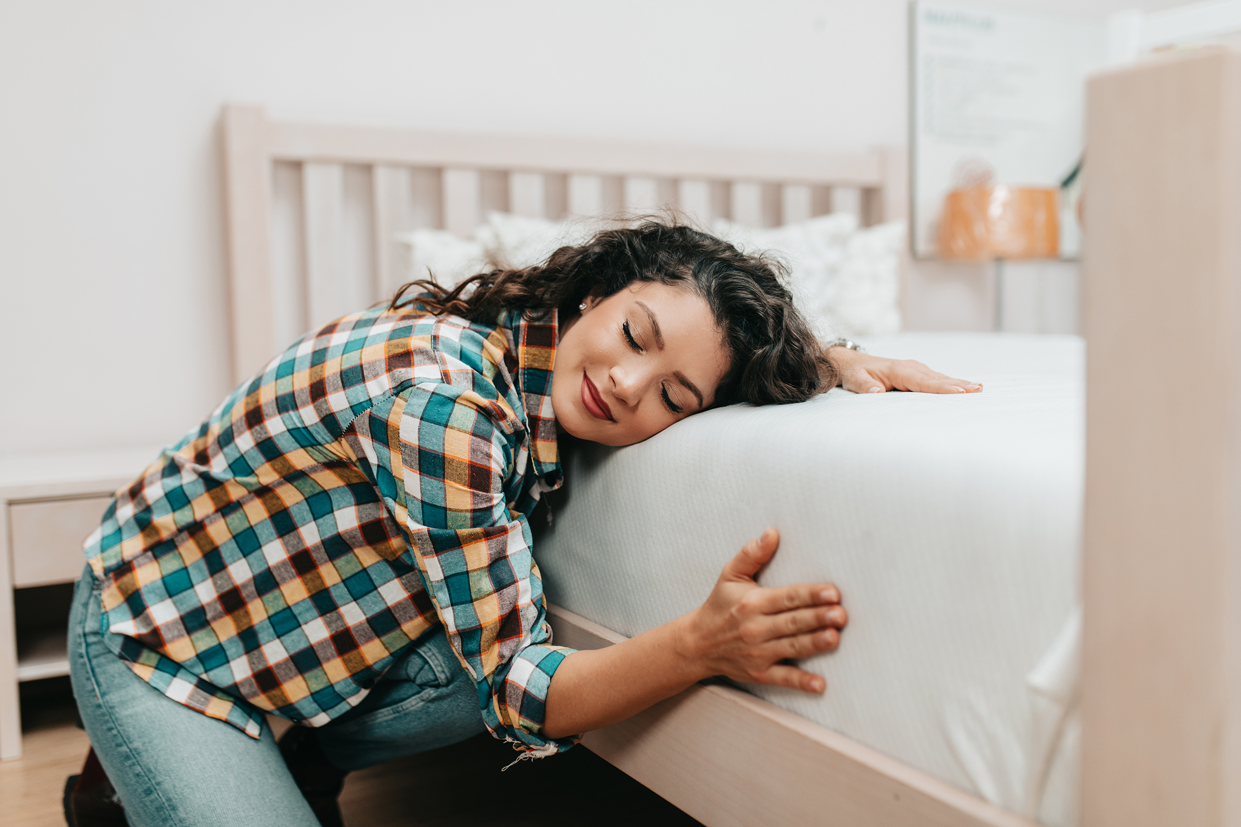 lady hugging mattress